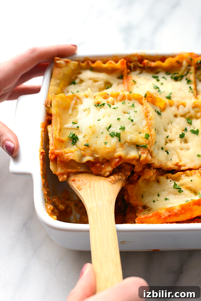 Serving spoon with sweet potato lasagna sweet potato lasagna on a serving spoon