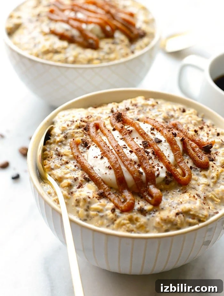 Two bowls of Coffee Overnight Oats with caramel sauce and coffee.