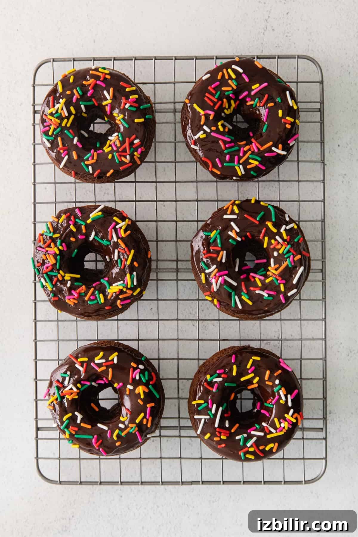 Baked donuts cooling on a wire rack baked donuts on wire rack