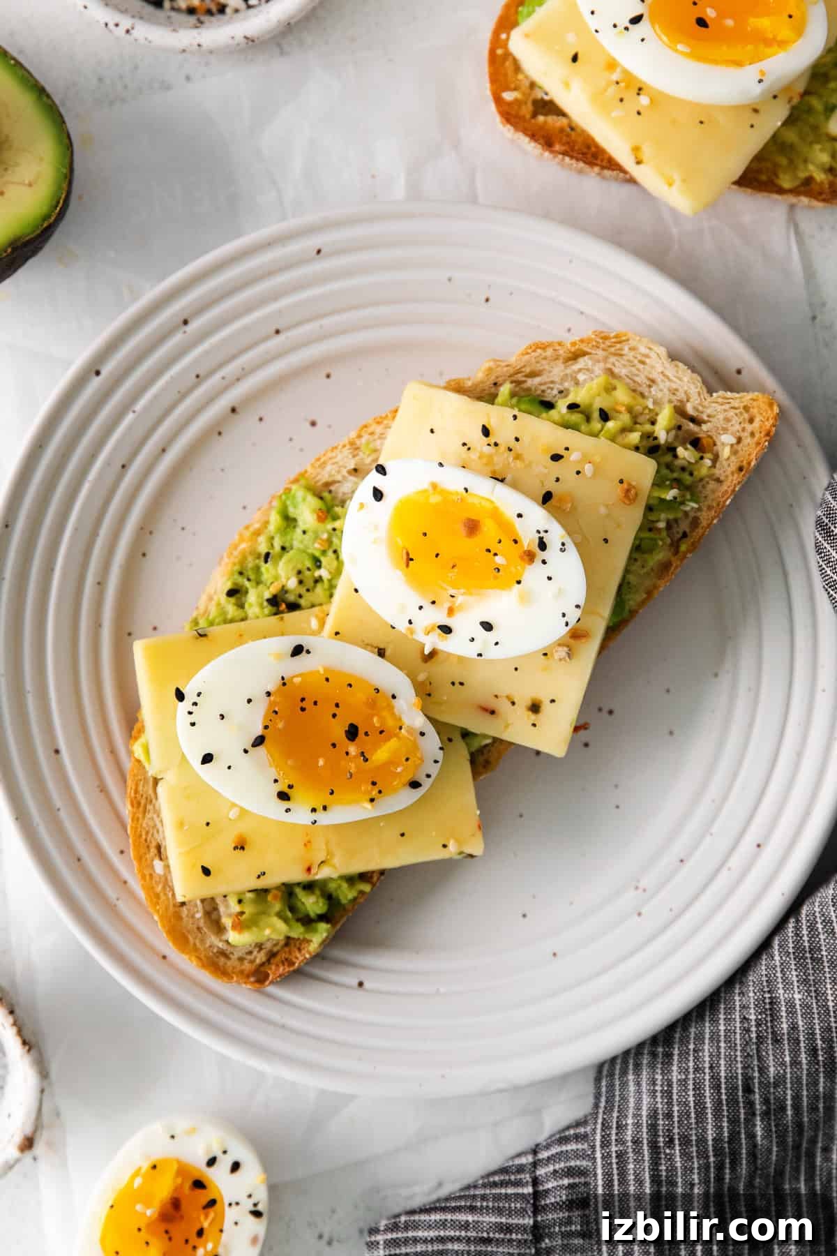 Egg on avocado toast soft boiled eggs on top of avocado toast