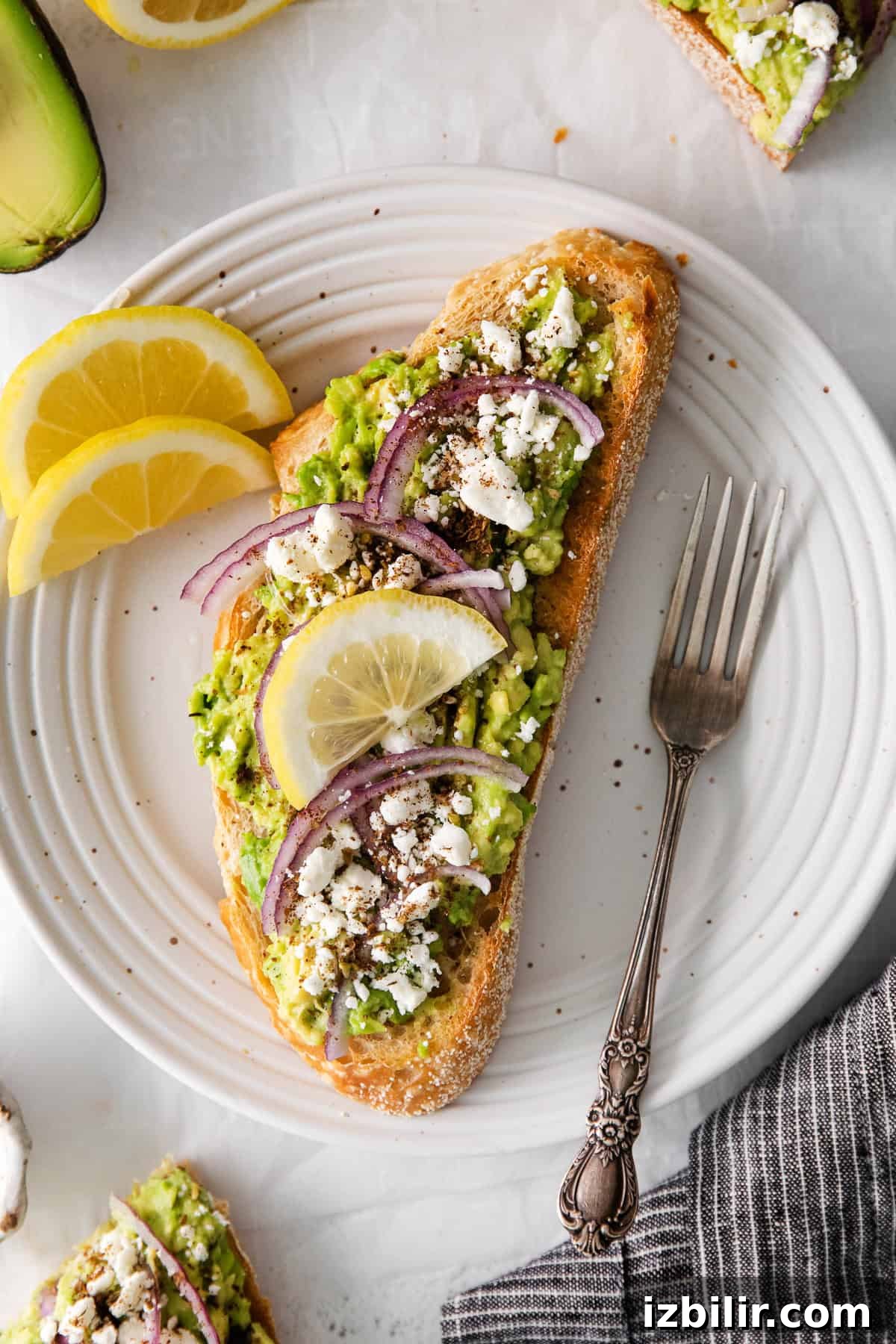 Mediterranean avocado toast mediterranean avocado toast on a plate