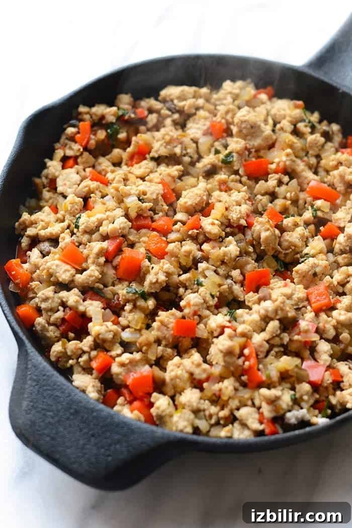 Chicken and peppers in skillet for Thai lettuce wraps