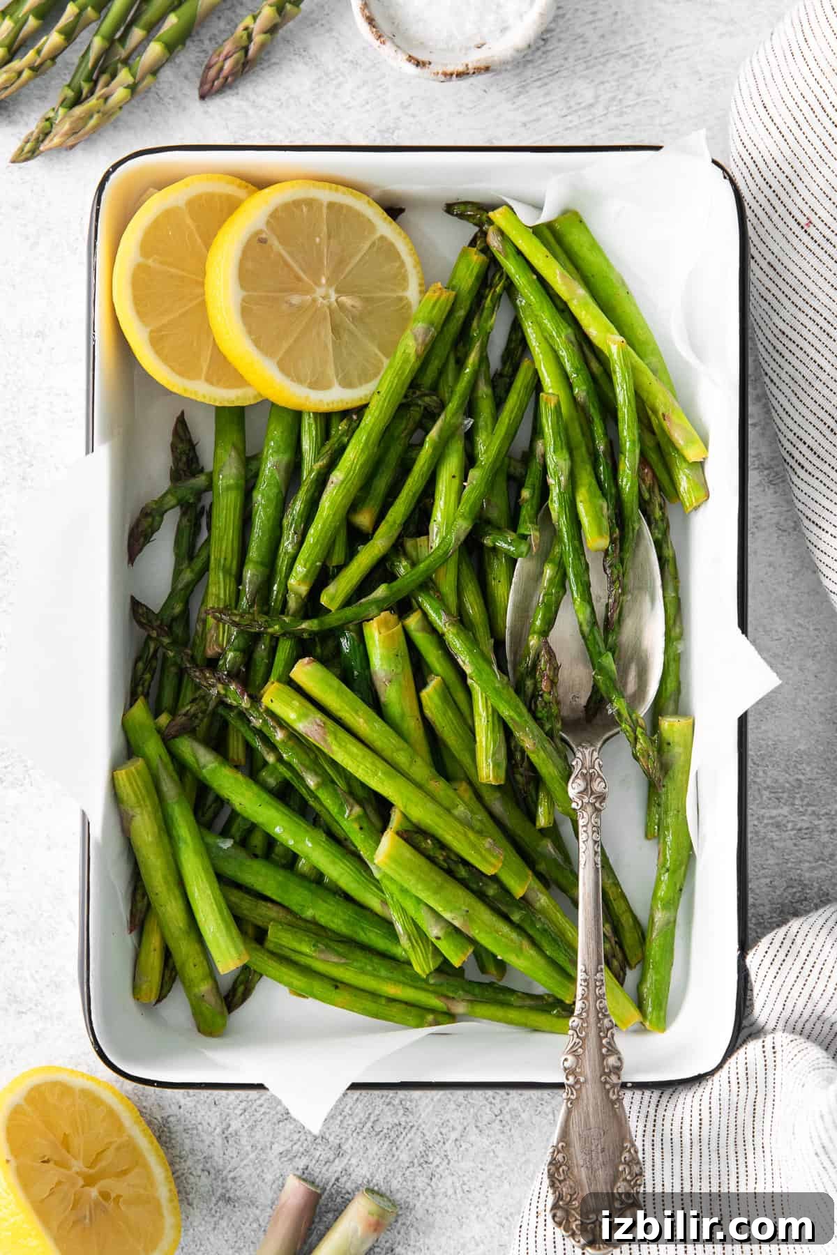 Crispy Air Fryer Asparagus with Lemon and Garlic 2 Air fryer asparagus in a tray.