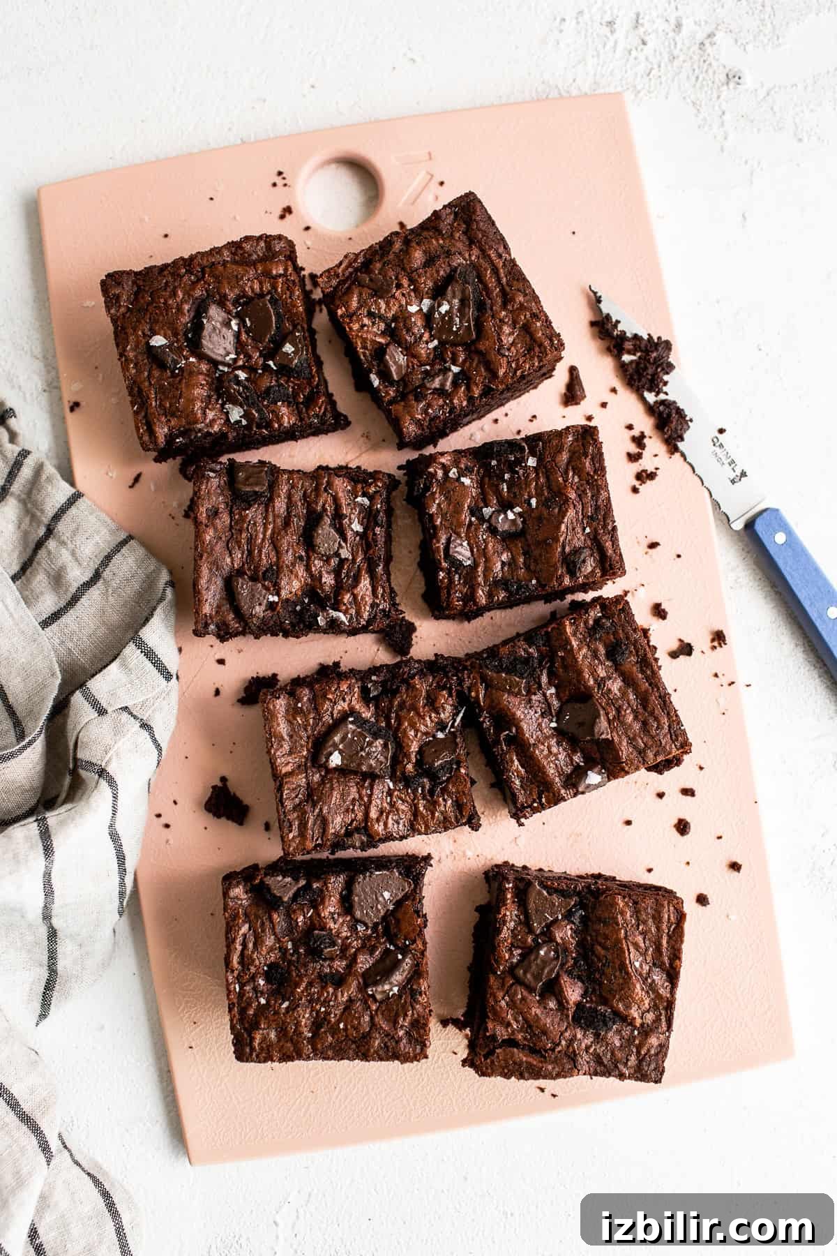 The most delicious Chocolate Mint Brownies are super fudgy and fully equipped with Thin Mint Cookies! chocolate mint brownies on cutting board