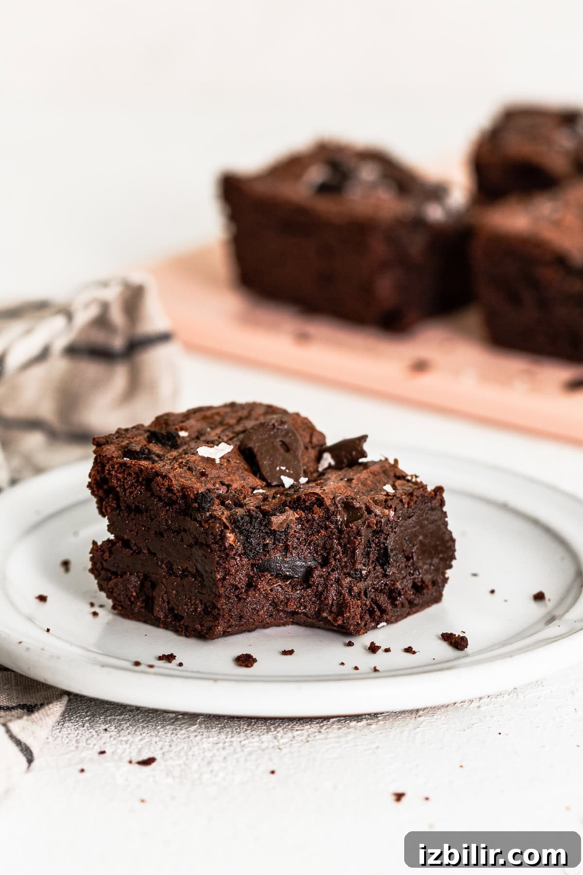 The most delicious Chocolate Mint Brownies are super fudgy and fully equipped with Thin Mint Cookies! brownies on plate