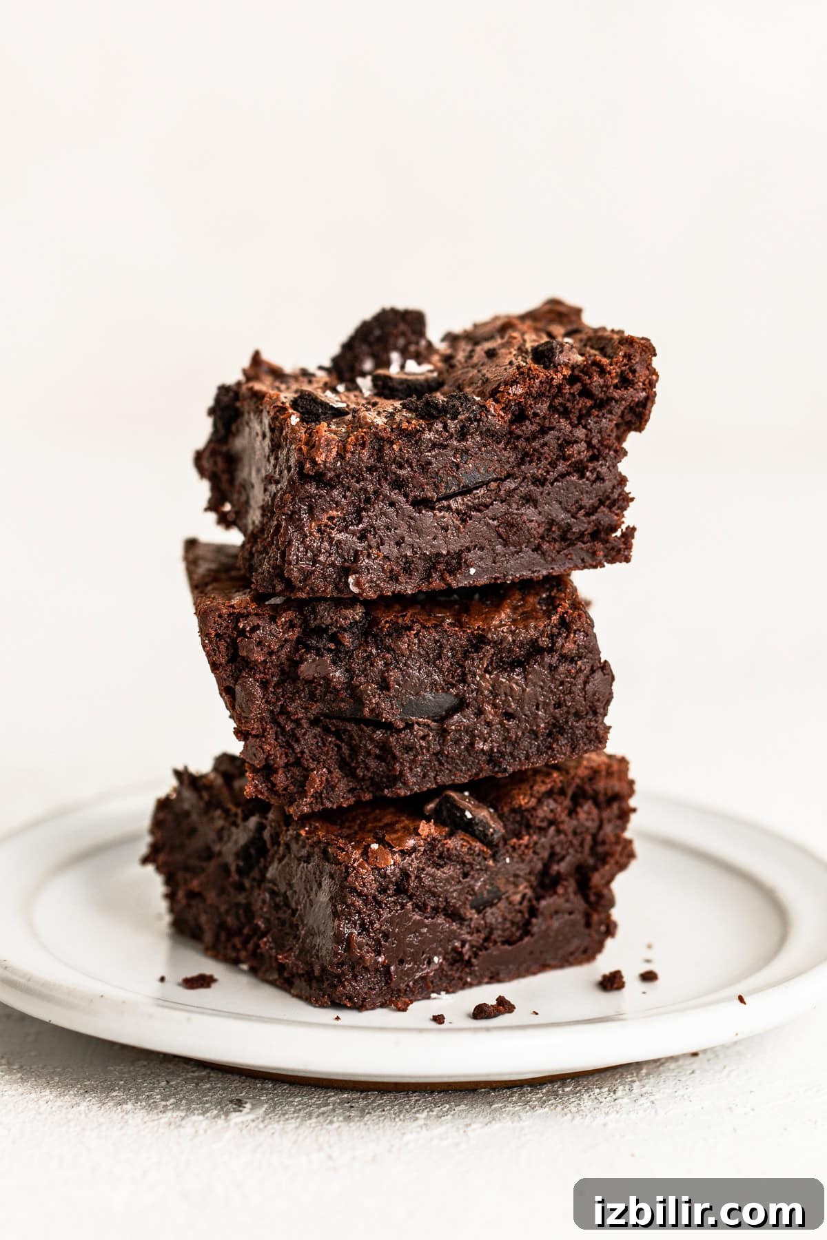 The most delicious Chocolate Mint Brownies are super fudgy and fully equipped with Thin Mint Cookies! stack of brownies