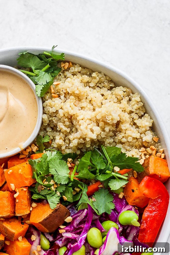 Coconut Quinoa Recipe with Lime and Toasted Coconut 2 A bowl of coconut quinoa salad with a dipping sauce.