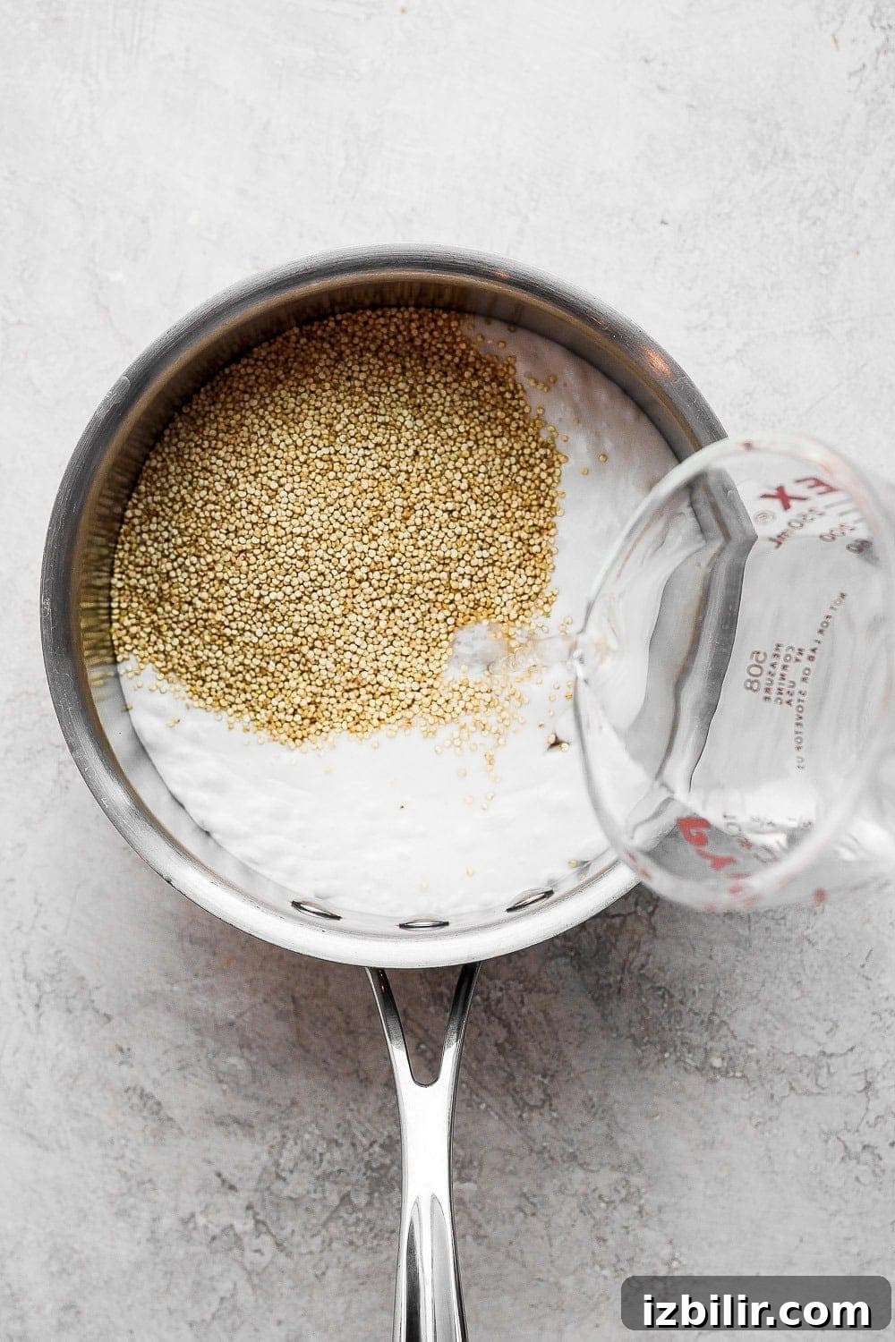 Coconut Quinoa Recipe with Lime and Toasted Coconut 3 Quinoa and coconut milk in a saucepan