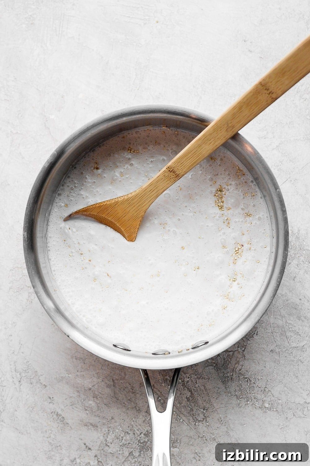 Coconut Quinoa Recipe with Lime and Toasted Coconut 4 Stirring together coconut milk and quinoa