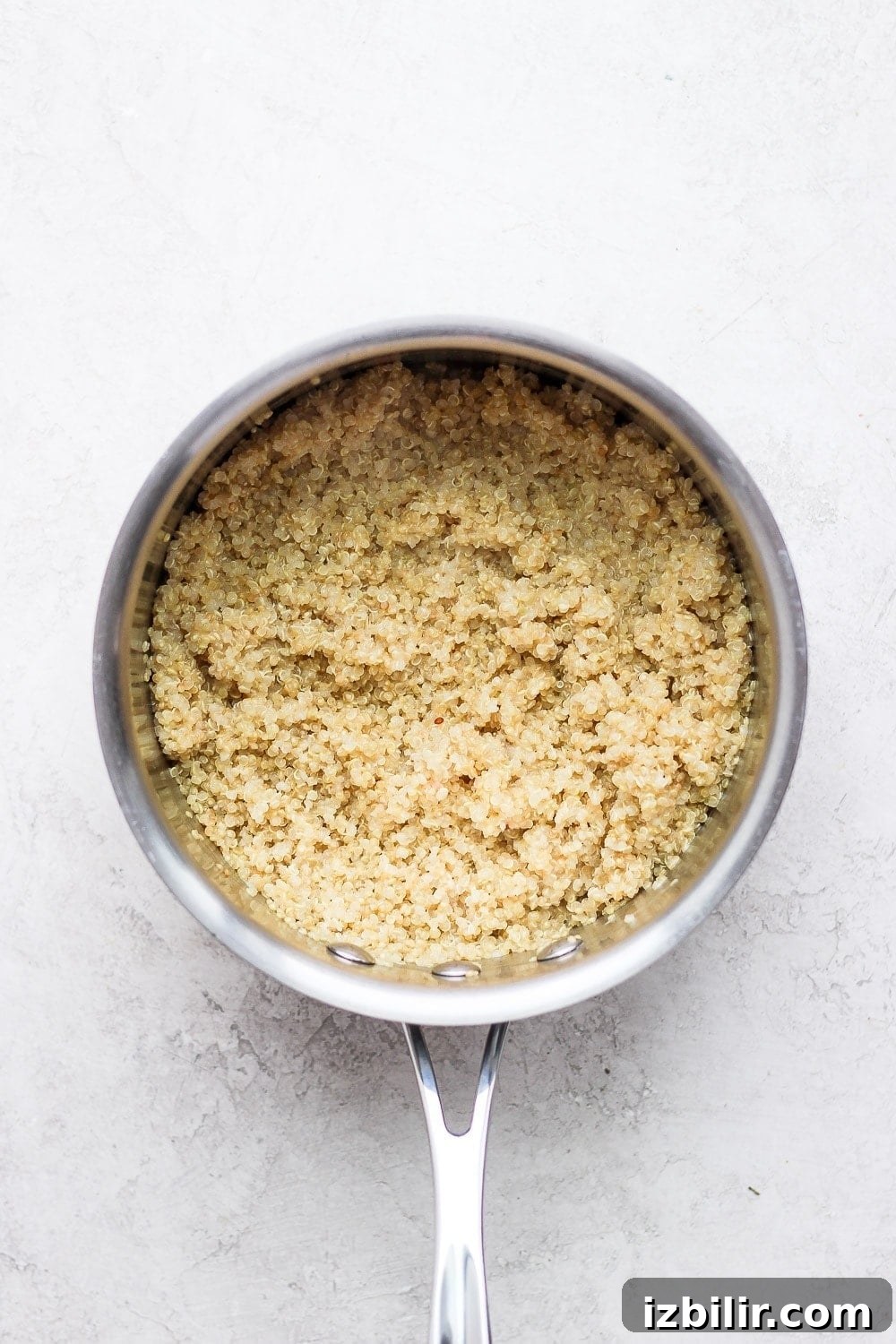 Coconut Quinoa Recipe with Lime and Toasted Coconut 5 Cooked quinoa in a saucepan