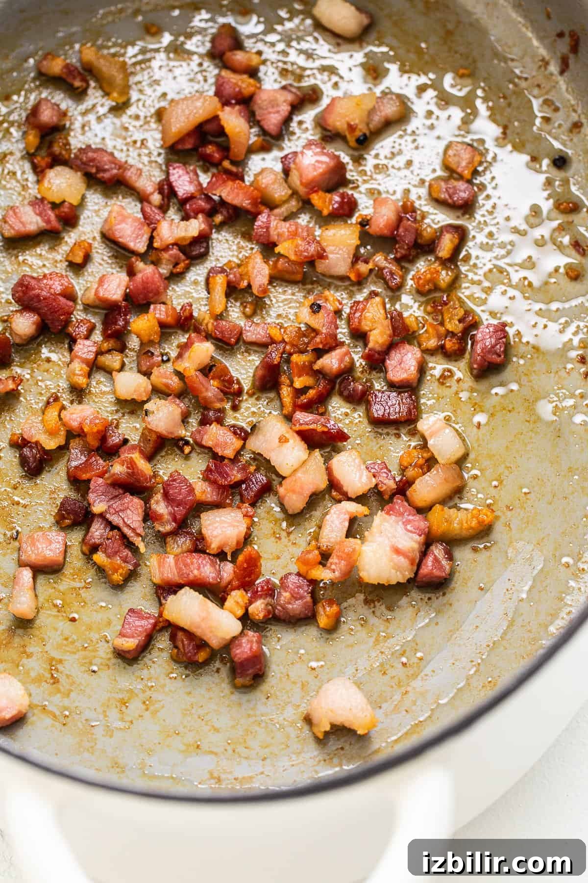Pancetta sautéing in a dutch oven.
