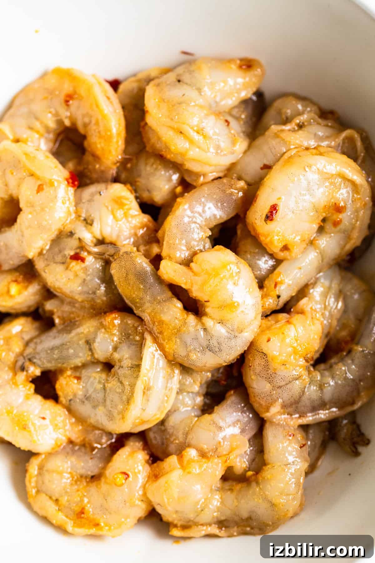 Shrimp marinating in sesame and soy mixture shrimp fried rice marinade