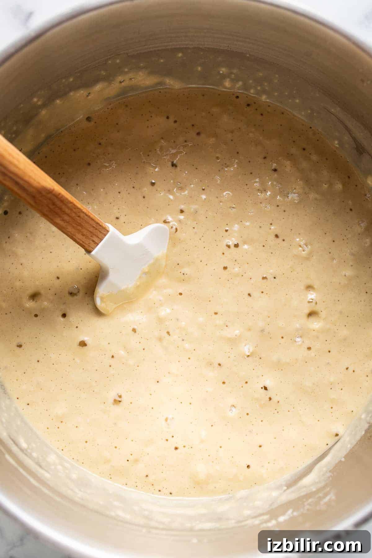 Homemade Fluffy Pancake Recipe for Light, Tender Stacks 3 pancake batter in bowl