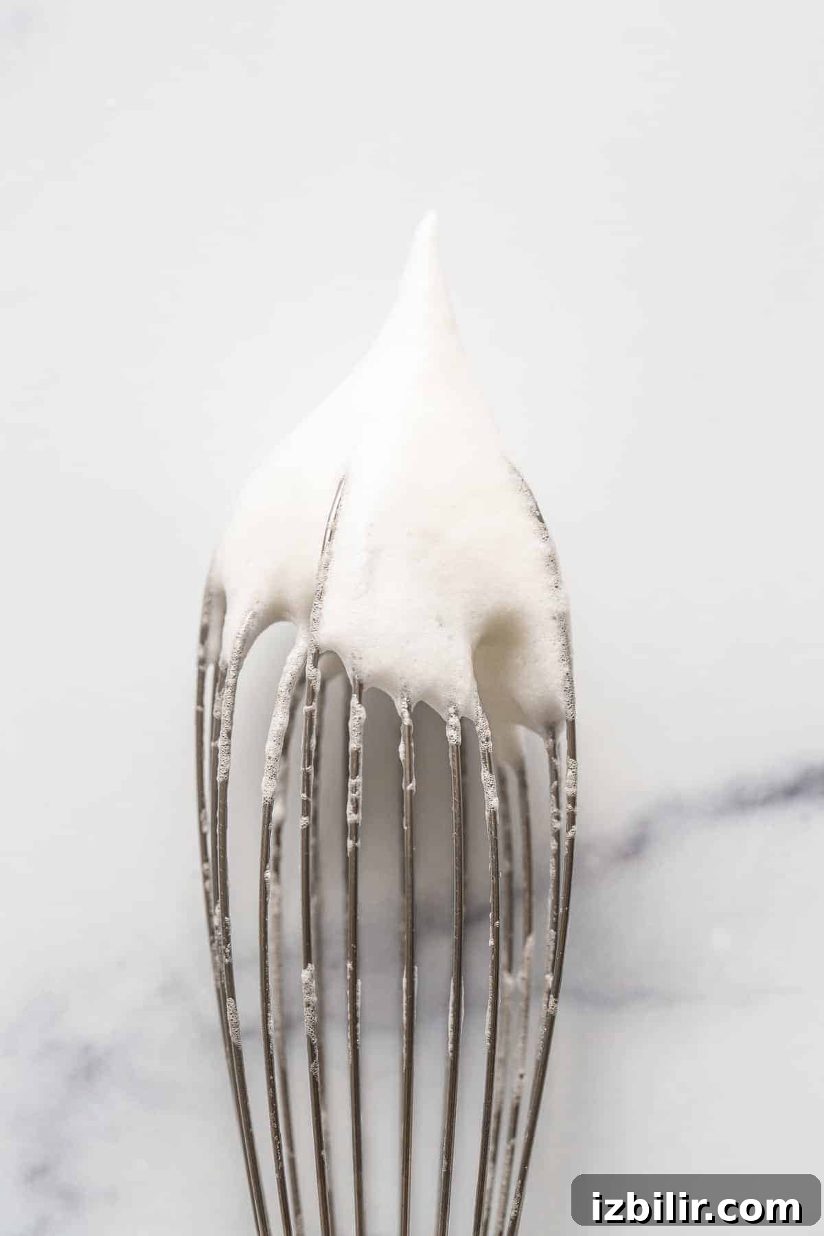 Homemade Fluffy Pancake Recipe for Light, Tender Stacks 4 stiff egg whites on whisk
