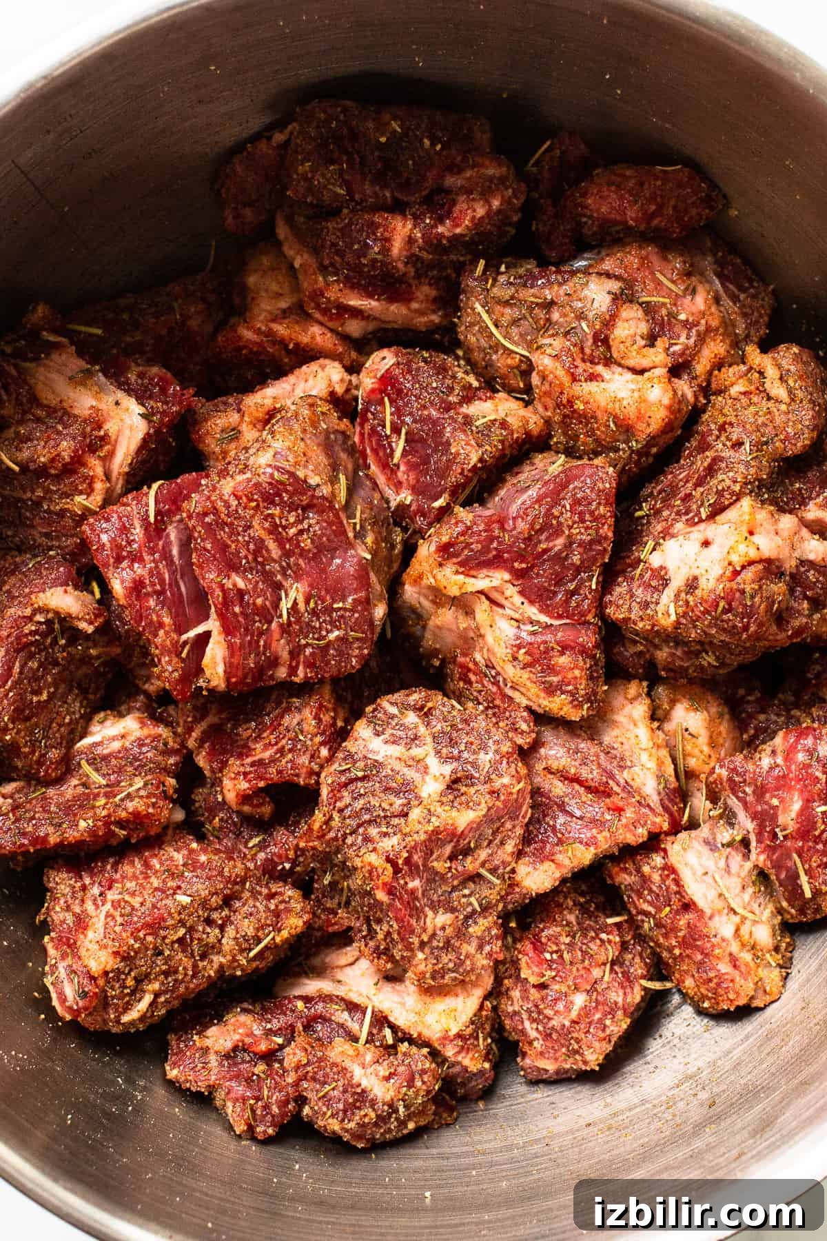 Beef chunks in a pot.
