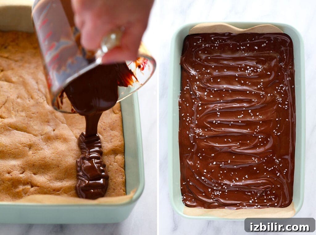 pouring chocolate topping on homemade protein bars