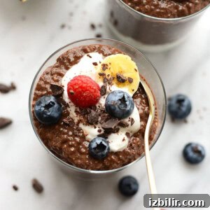 Chocolate chia seed pudding with berries and whipped cream.