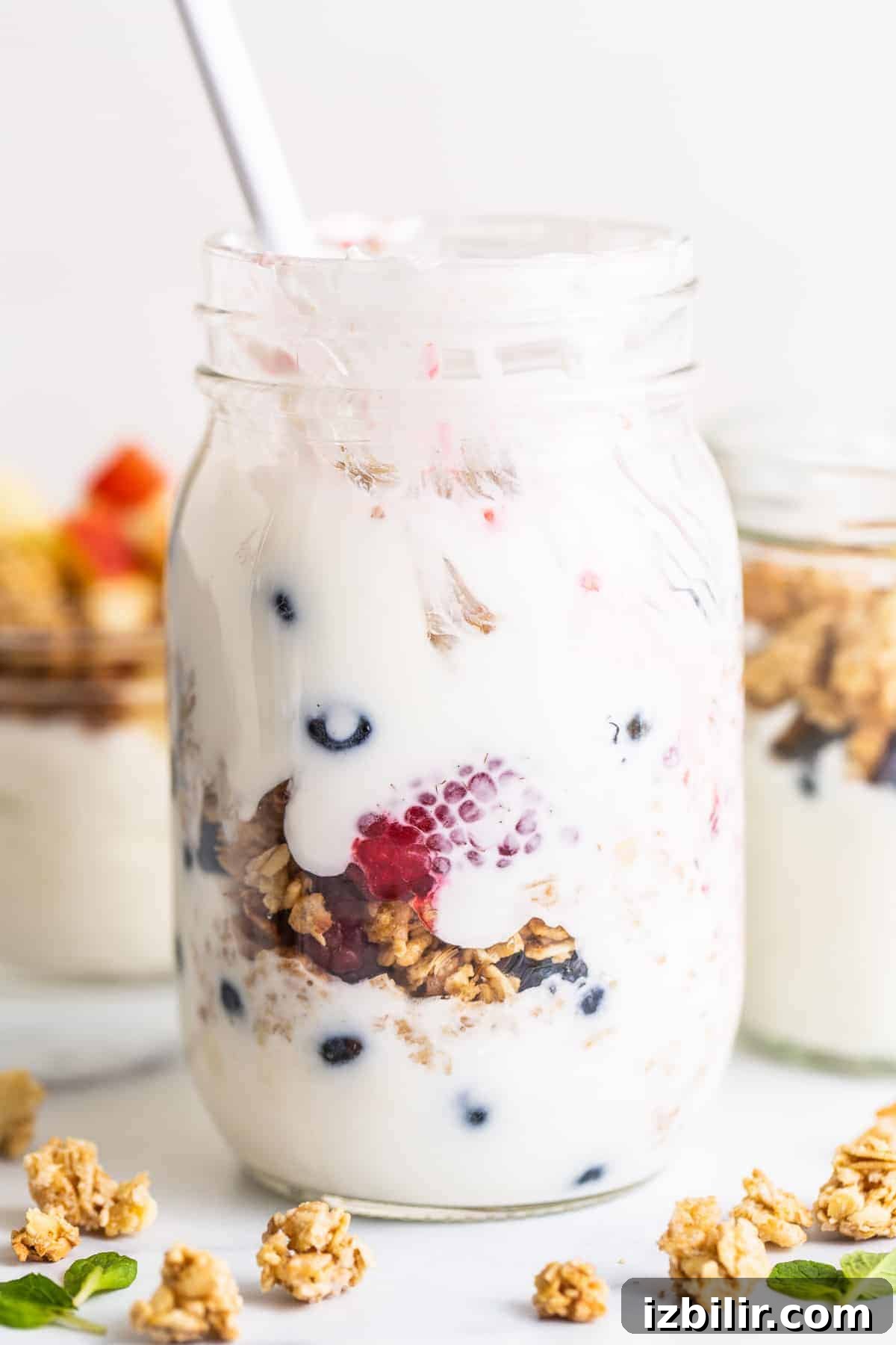 yogurt parfait in a mason jar with berries