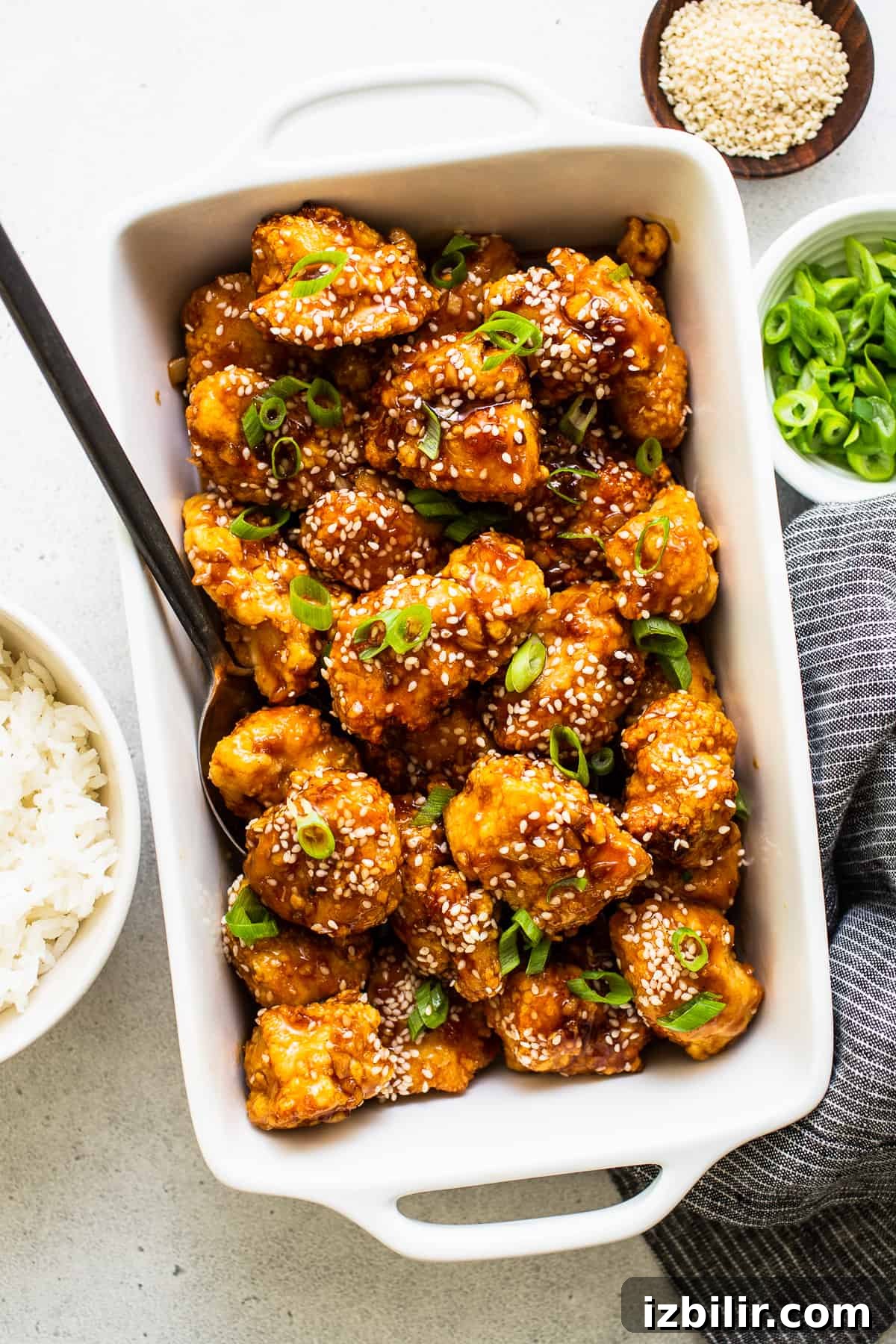 Honey sesame chicken ready to serve honey sesame chicken in dish with sesame seeds
