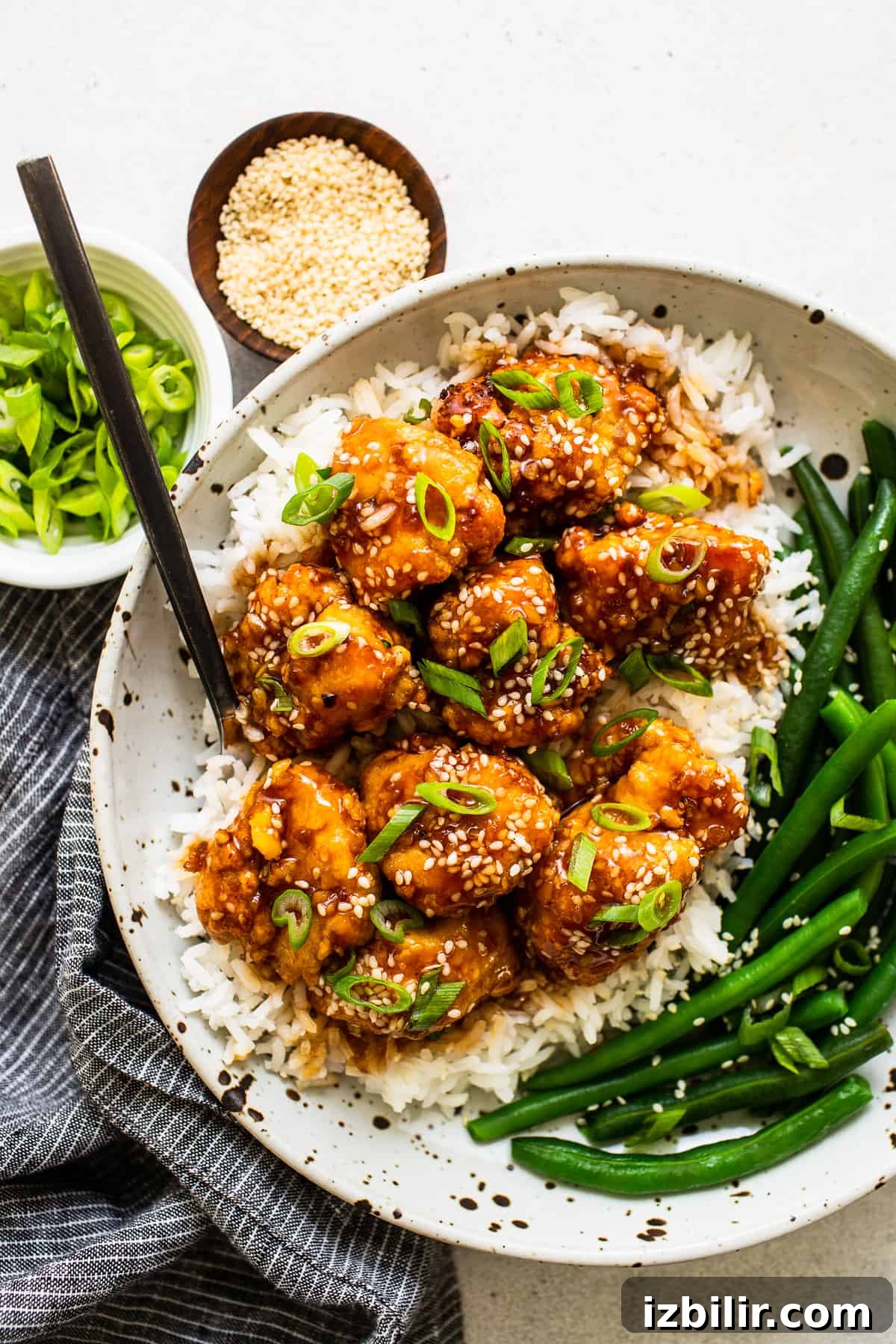 Sesame chicken with vegetables sesame chicken in bowl with veggies