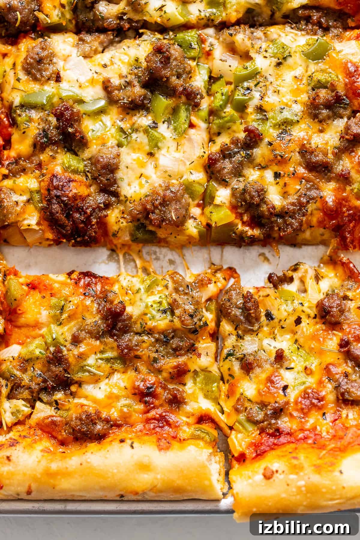 Finished sheet pan pizza pizza on baking sheet