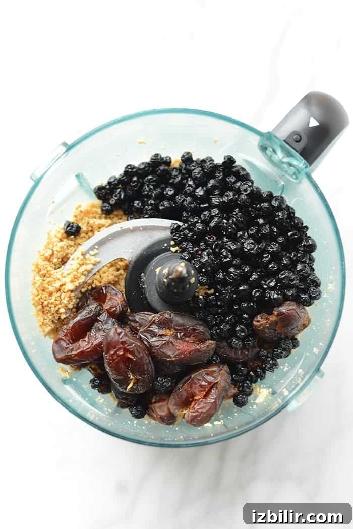 Make these delicious clean eating blueberry truffles for a sweet treat made with dried fruit and dark chocolate!