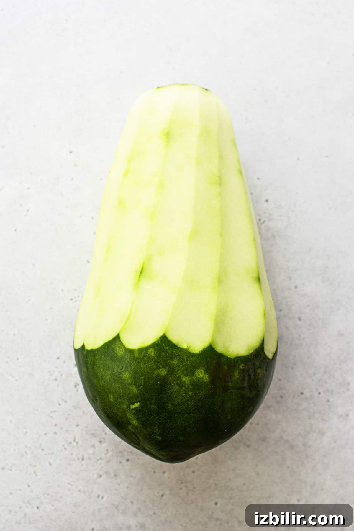 Peeled green papaya ready for shredding. Peeled green papaya.