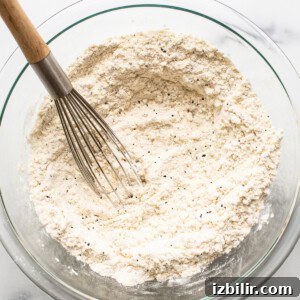 The dry ingredients for lemon poppy seed bread in a bowl.