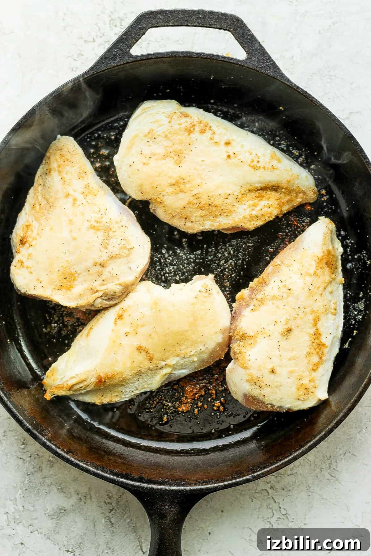 Seared chicken breasts for tinga.