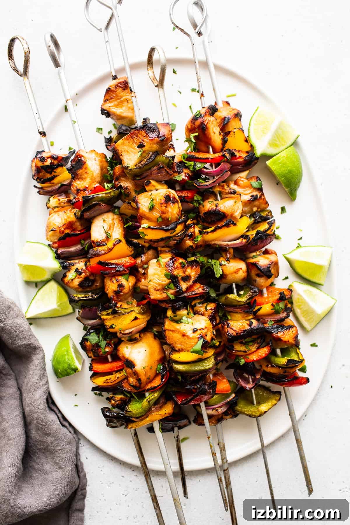 Rainbow grilled chicken kabobs Grilled chicken kabobs on a plate.