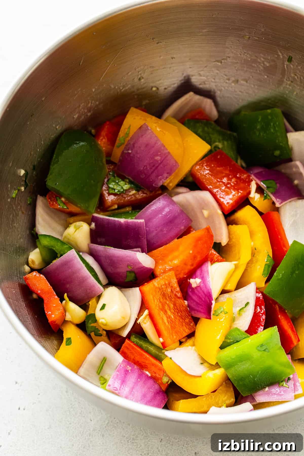 Rainbow veggies Rainbow veggies marinating in a bowl.