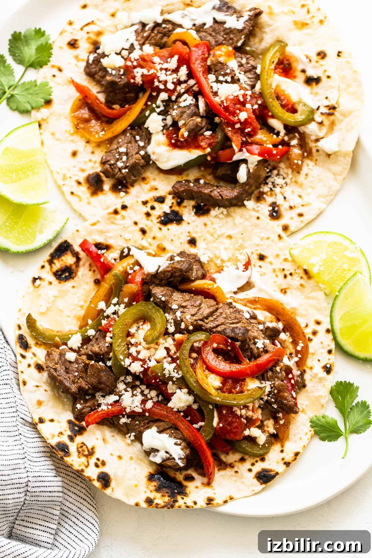 Steak fajitas on a tortilla.