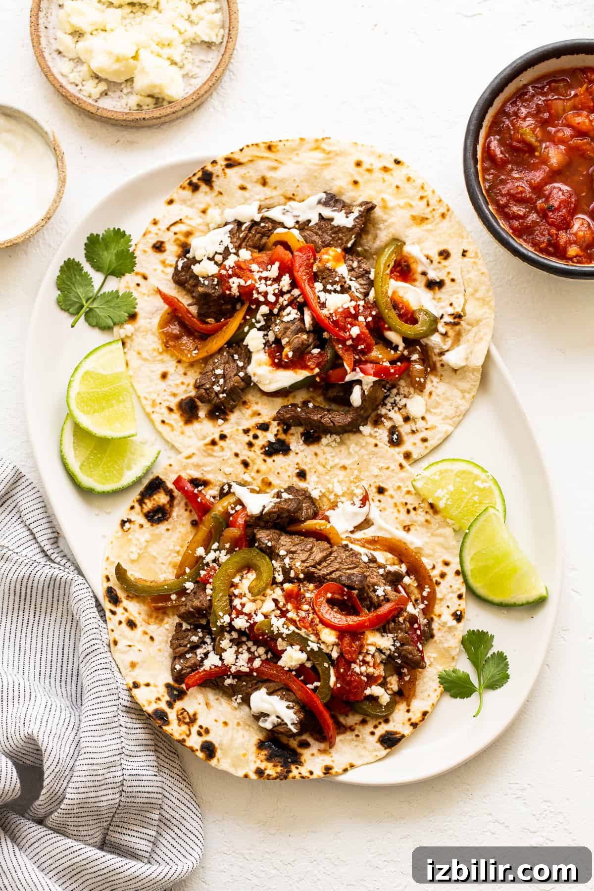 Steak fajitas on a plate.