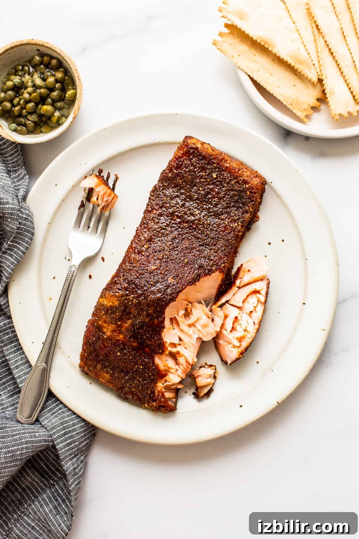 Smoked salmon fillet on a plate with a fork
