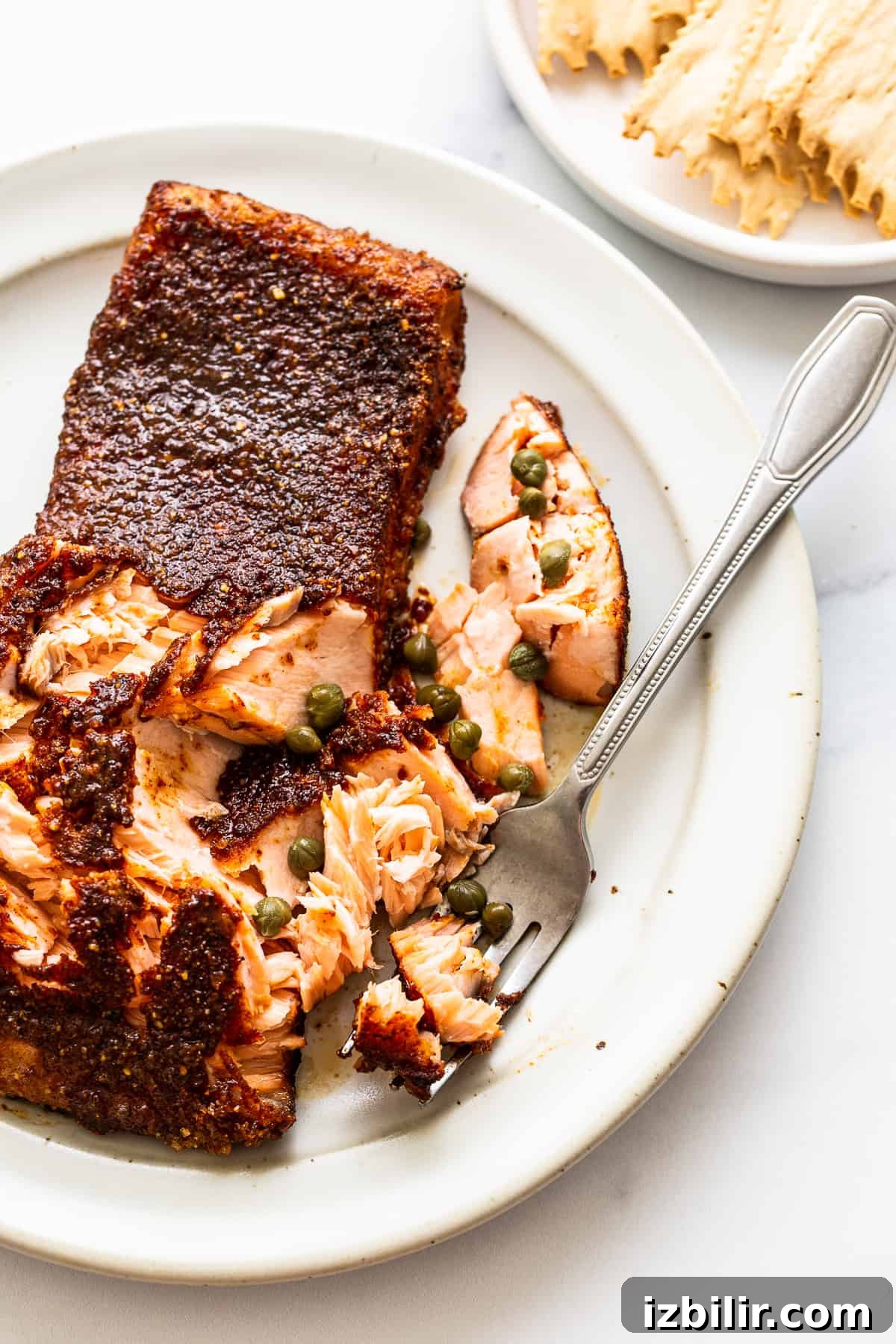 Fork flaking into smoked salmon