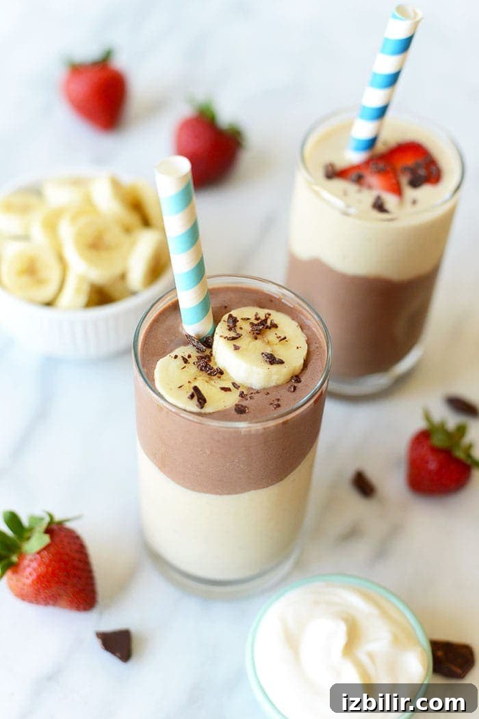 Topped chocolate banana smoothie smoothie with straw and bananas