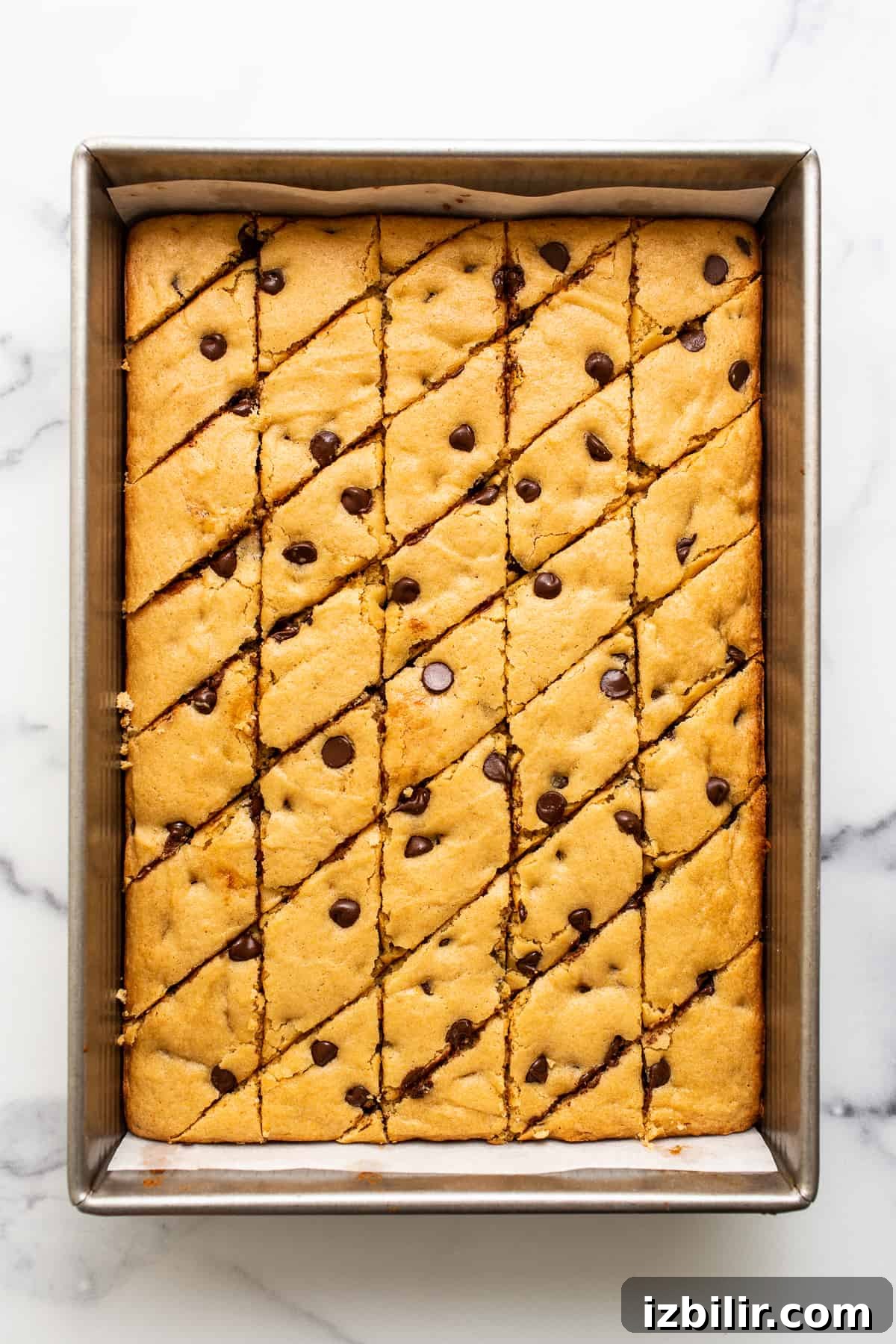 Sliced blondie bars on a plate.