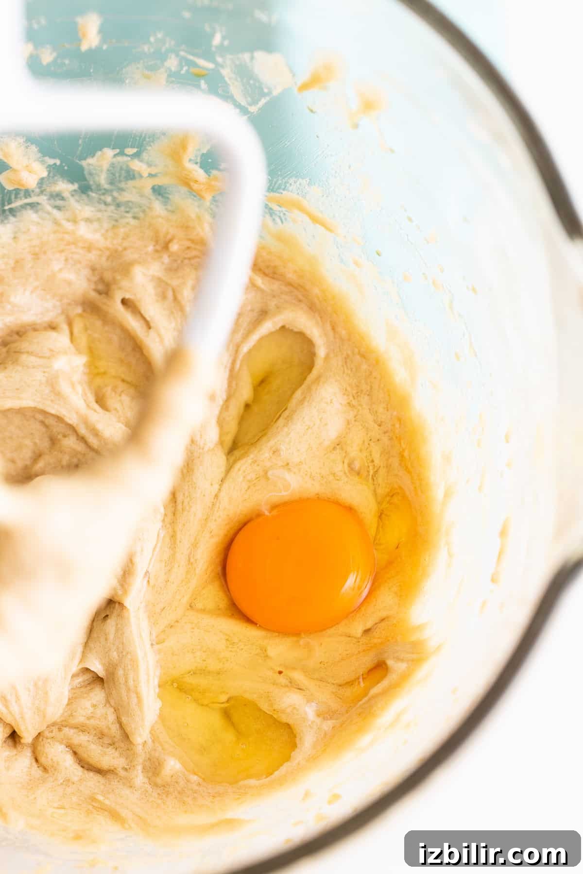 Mixing batter in bowl.