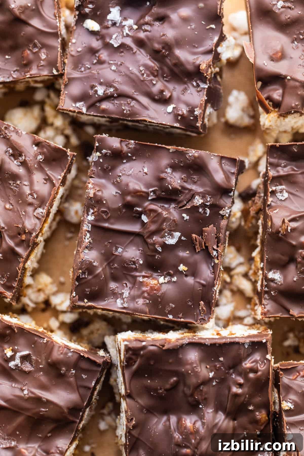 No-Bake Rice Cake Magic Bars Recipe with Chocolate and Nuts 6 A plate of chocolate covered graham cracker bars.