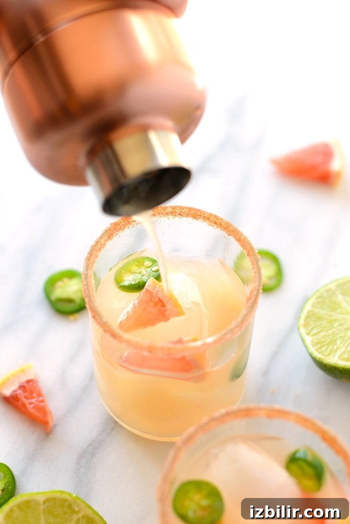 Pouring margarita into glass