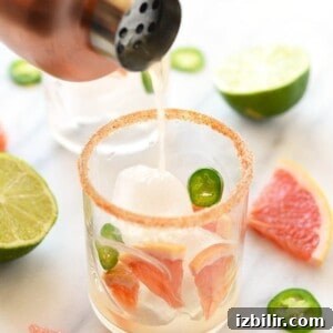 A zesty glass of grapefruit margarita with a hint of jalapenos.