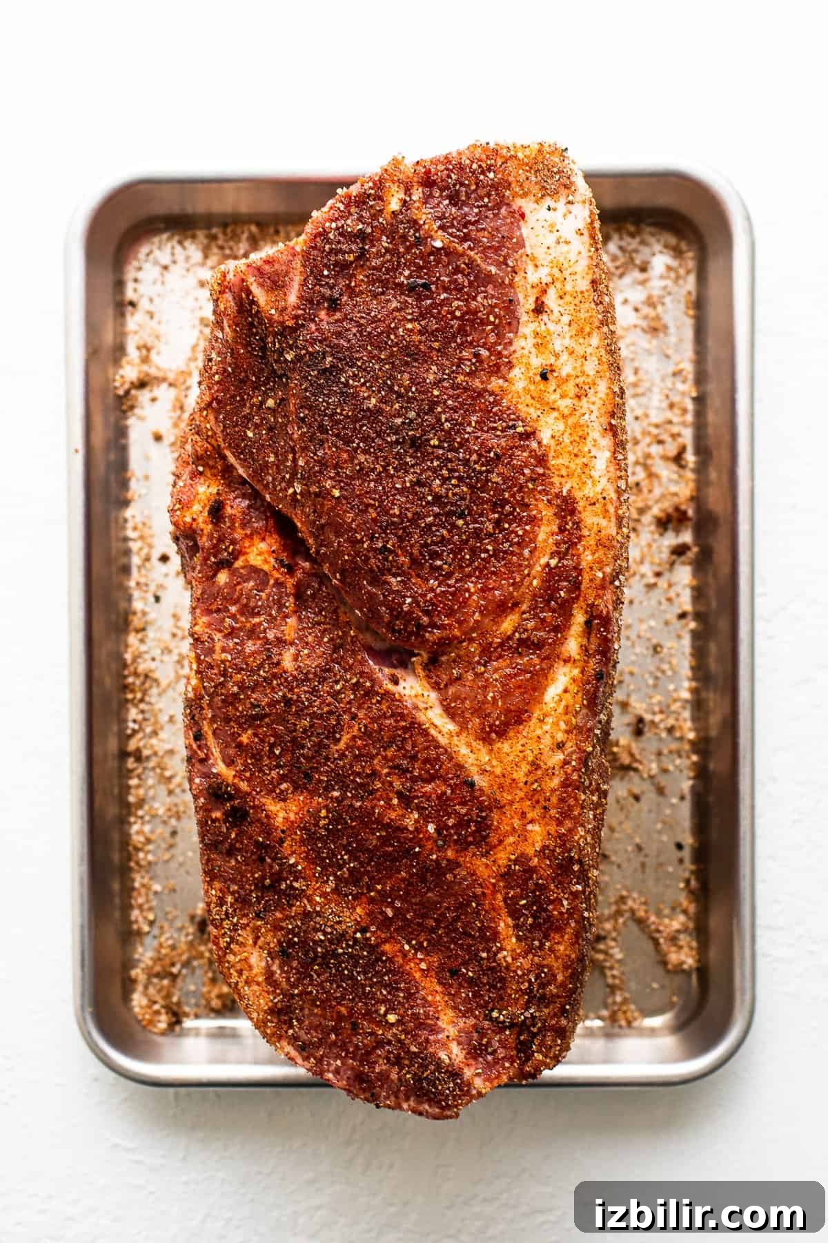 How to Smoke Pork Shoulder for Tender Pulled Pork 4 Pork shoulder sprinkled with dry rub.