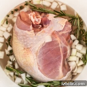 Smoked Turkey Breast Recipe for Juicy, Flavorful Meat 7 Turkey breast brining in a bucket.