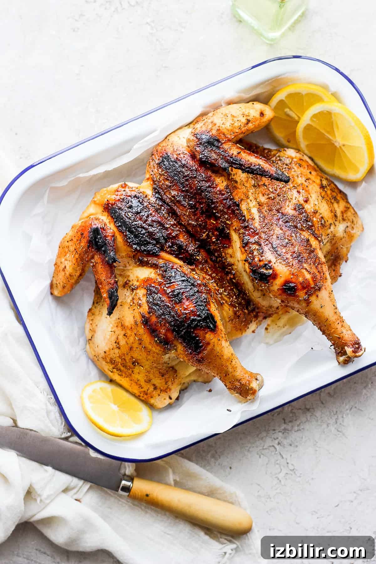 spatchcock chicken on platter.