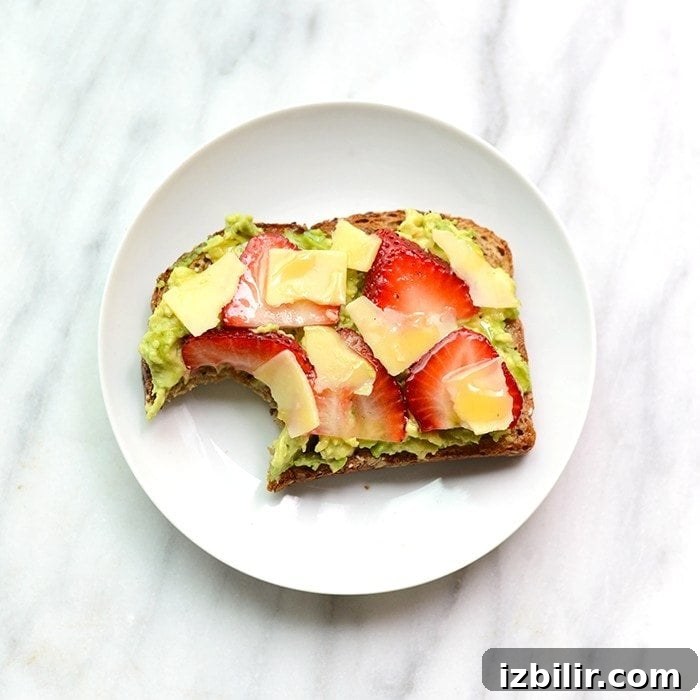 Jazz up your toast with some fresh fruit and cheese for an epic breakfast of Strawberry, Avocado, and White Cheddar Toast!