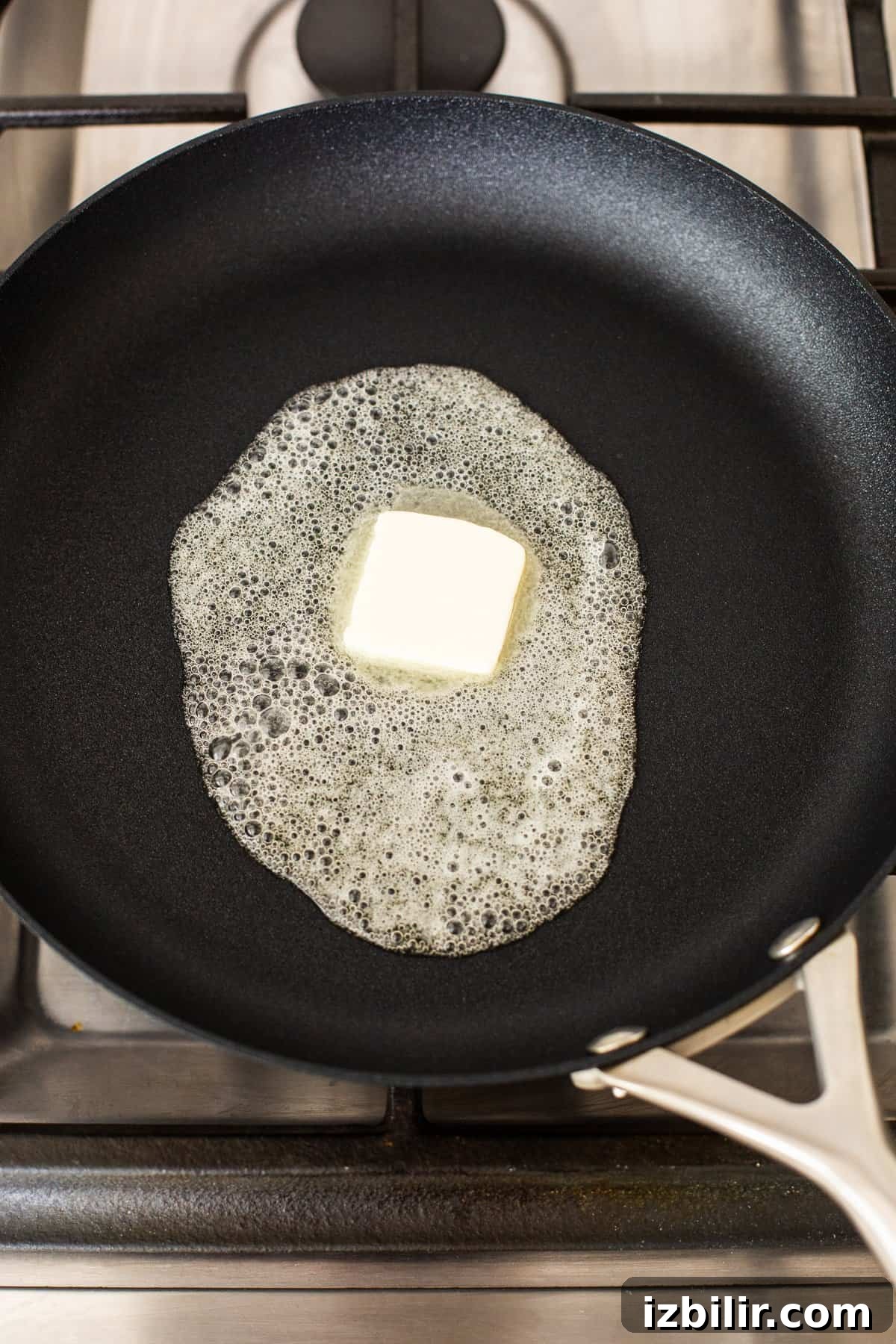 Butter melting in a skillet.