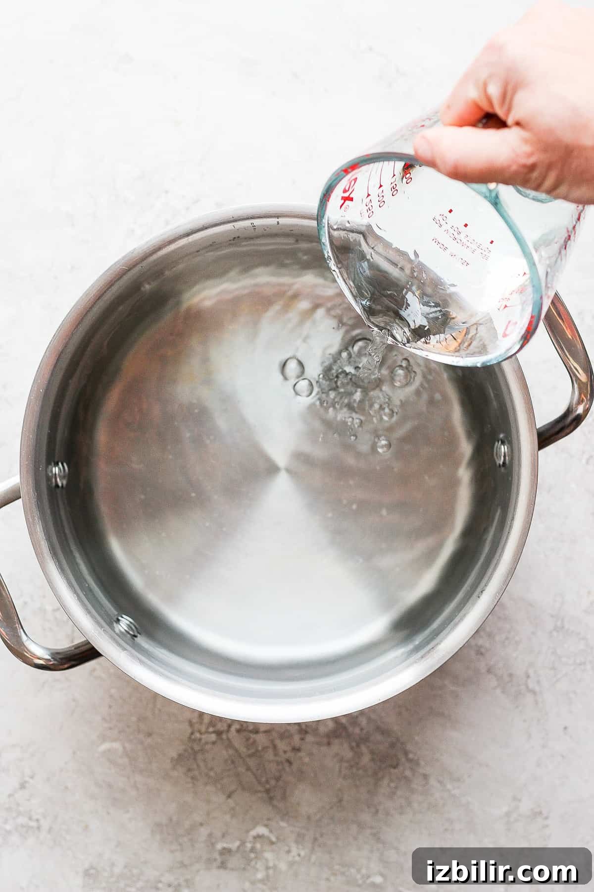 Adding water to pot for brine Adding water to pot.