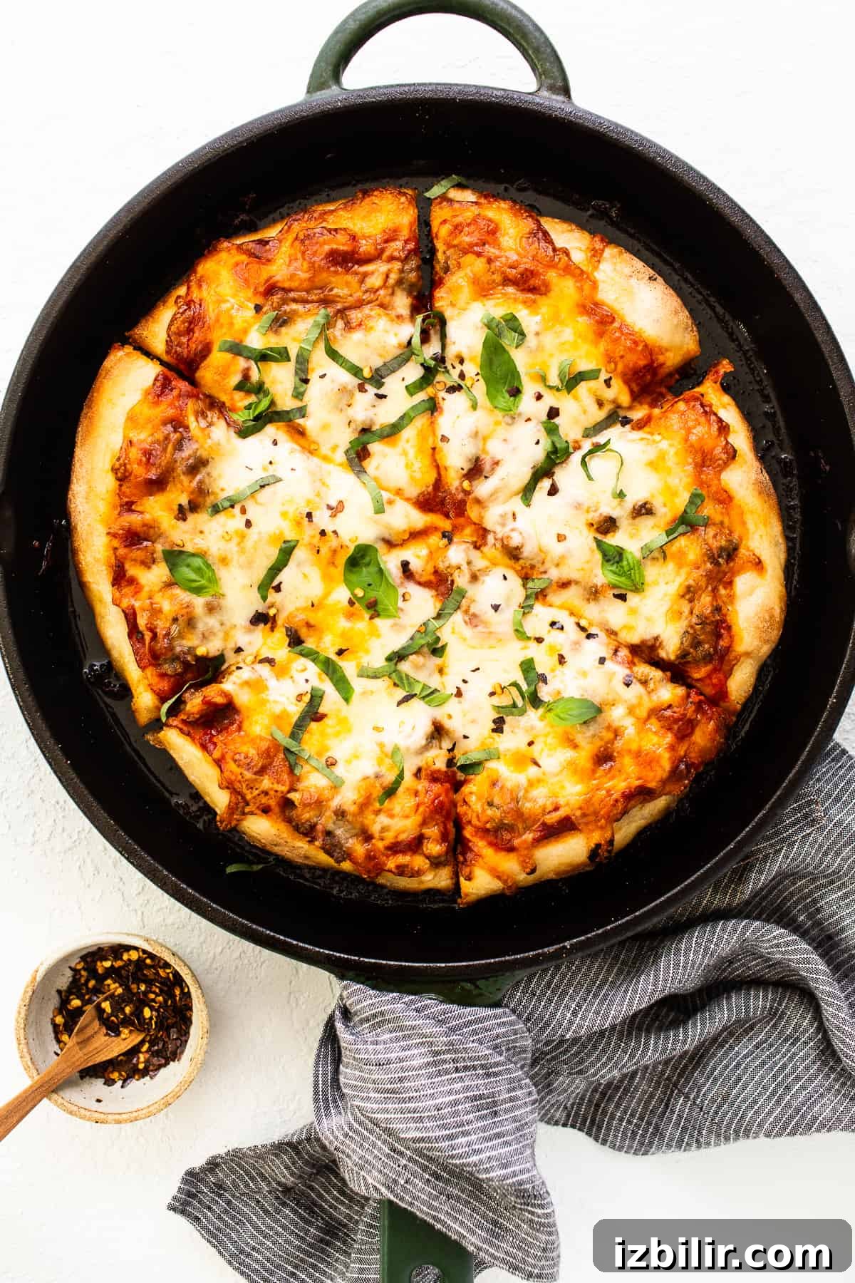 cast iron pizza with basil.