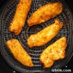 Air fryer coconut chicken tenders ready to serve.