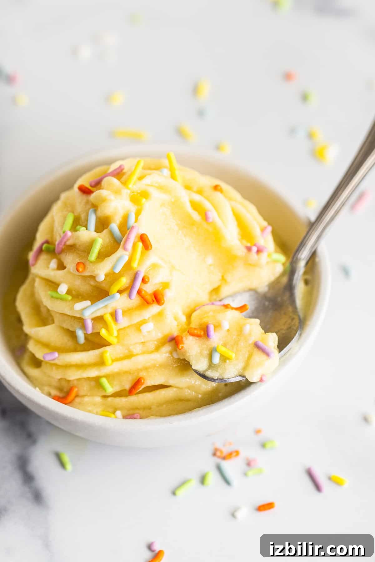Dole Whip in a bowl with a spoon.